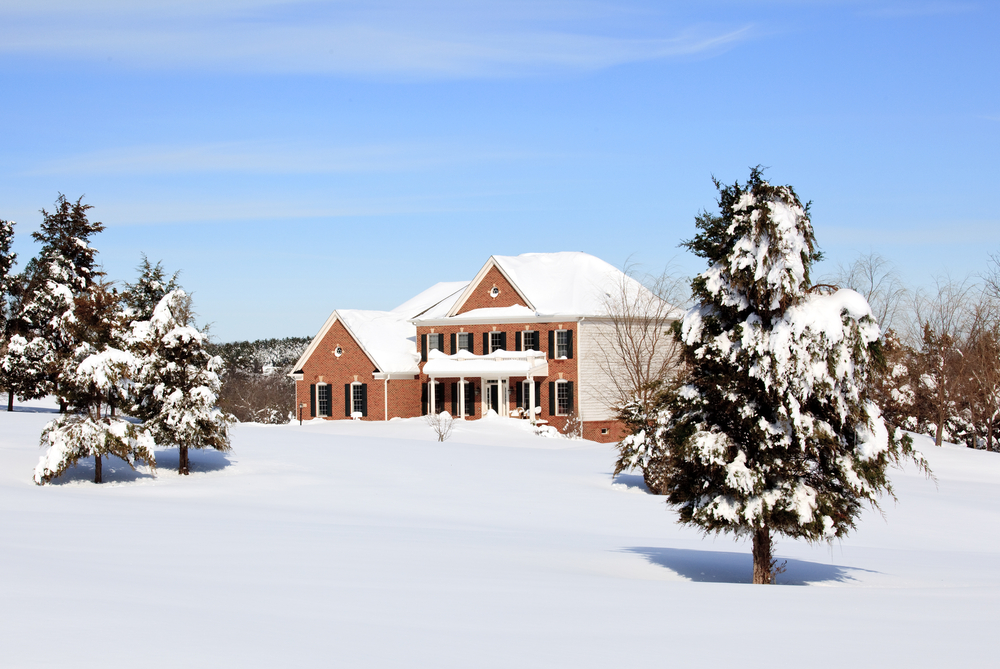 Modern single family home in snow - Spring Falls Landscaping